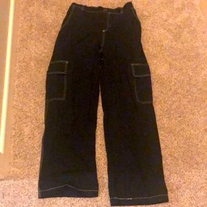 Black straight cut pants, white stitching and elastic waist band